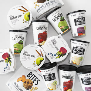 Daily Harvest smoothies, breakfast bowls, forager bowls, and bites displayed on white background